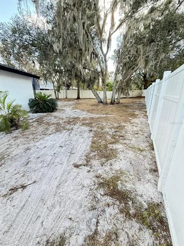 a view of outdoor space with deck and trees