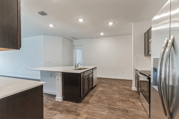 a kitchen with a sink and refrigerator