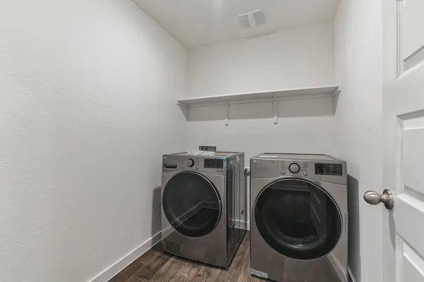 a view of storage and utility room with washer and dryer