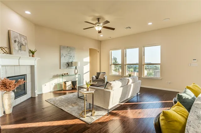 a living room with furniture fireplace and window