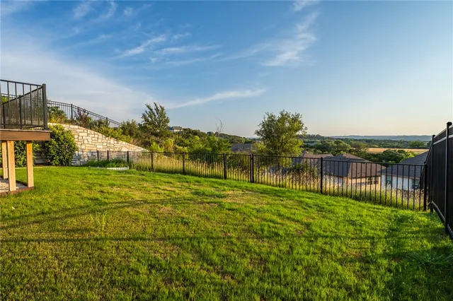 a view of a patio with couches and city view