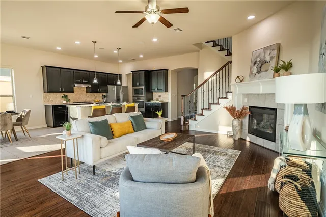 a living room with furniture and a fireplace