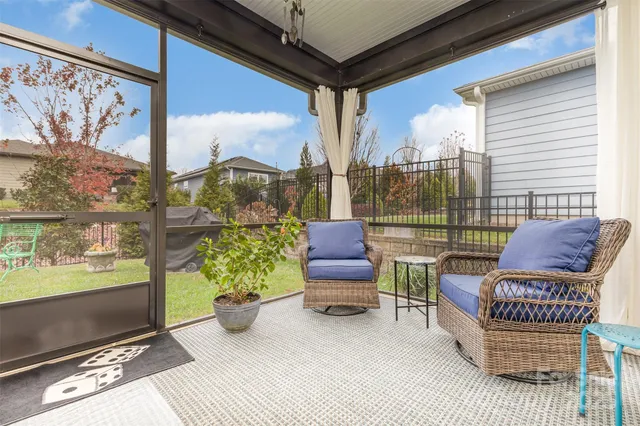 a view of a chairs and table in balcony