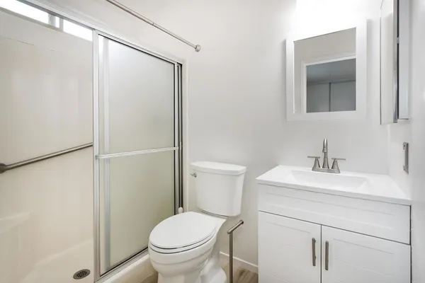 a bathroom with a sink toilet and vanity