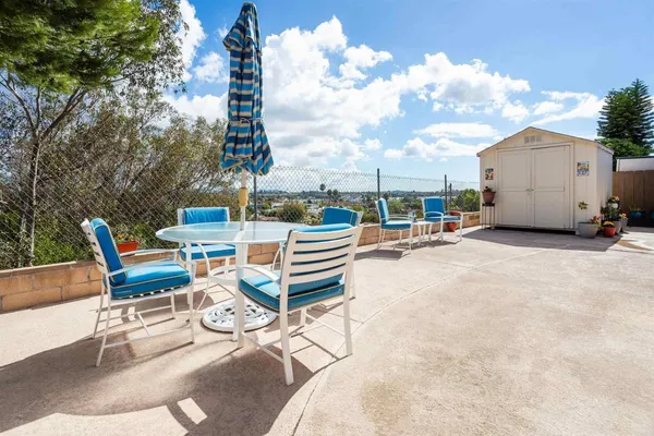 a view of a terrace with sitting area