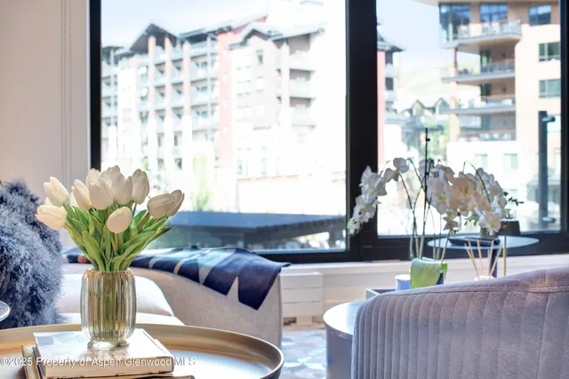 a living room with furniture and a lamp