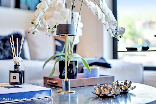 a living room with furniture and a table