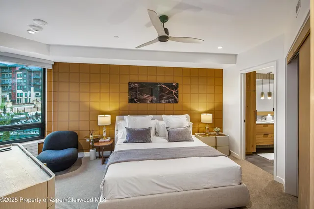 a bedroom with a bed and a couch