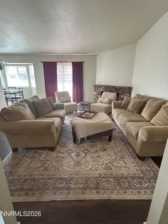 a living room with couches and a couch