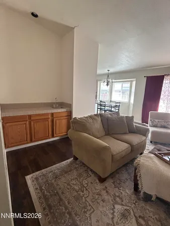 a living room with furniture and a rug