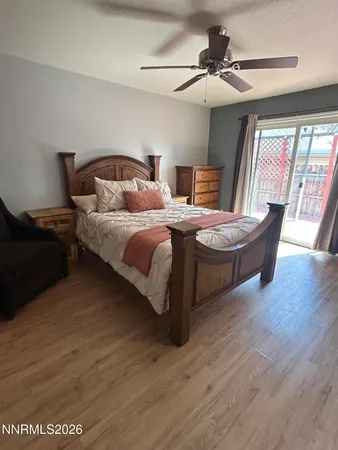 a bedroom with bed and window