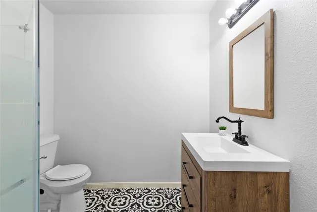 a bathroom with a sink and a toilet