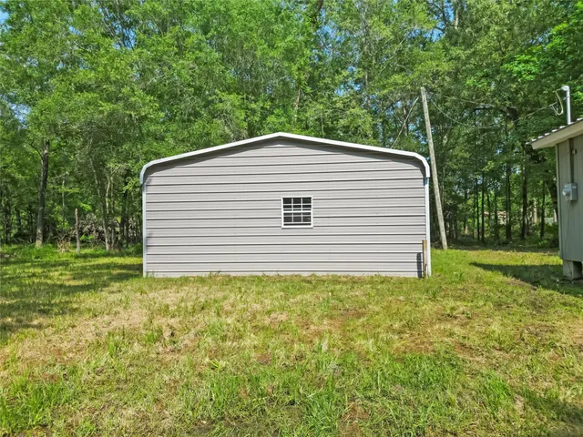 a backyard of a house with lots of green space