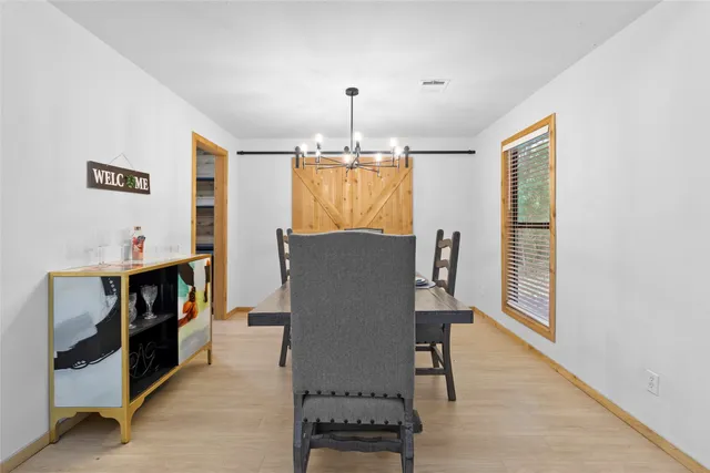 a view of livingroom with furniture and chandelier