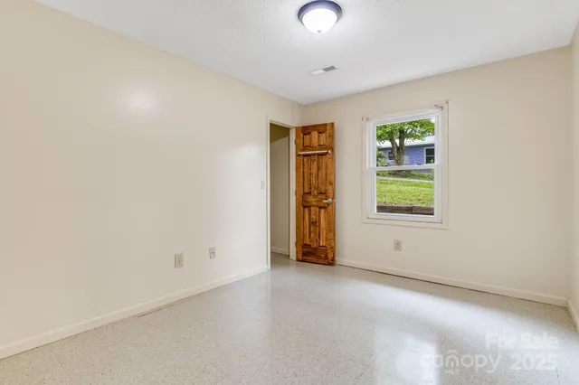 an empty room with windows