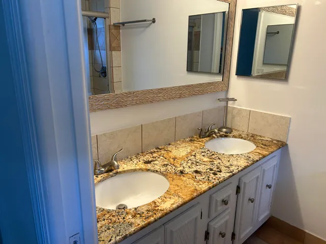a bathroom with a toilet and shower