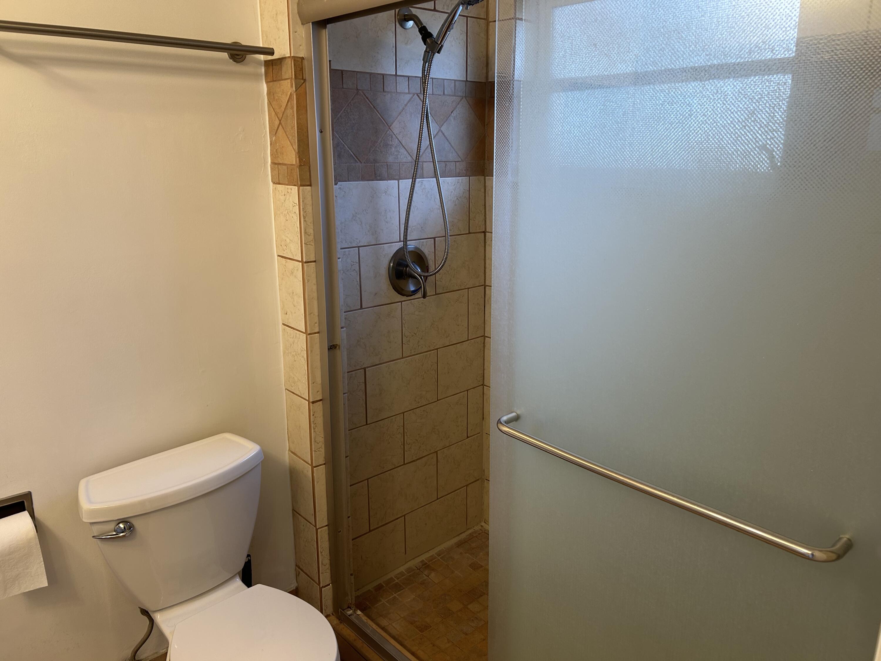 6514 Spring Bottom Way, Unit 125 Boca Raton, FL 33433 - Photo 16 of 28 a bathroom with a toilet and shower