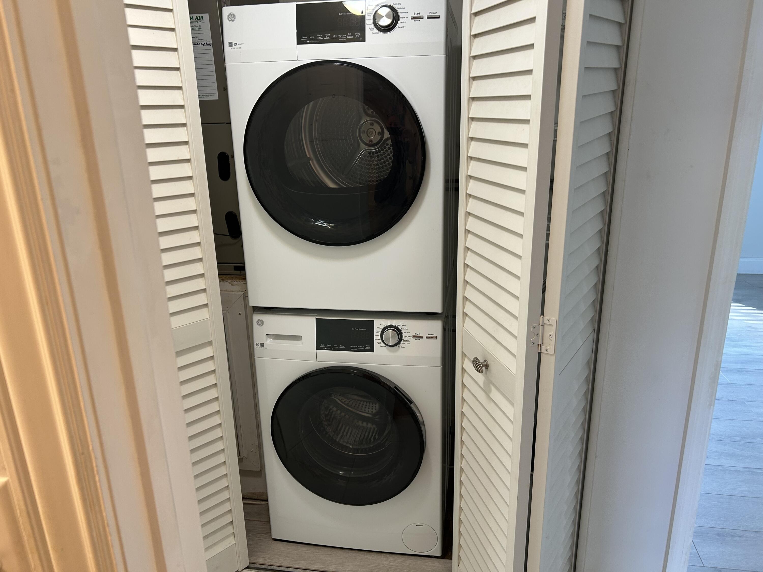 6514 Spring Bottom Way, Unit 125 Boca Raton, FL 33433 - Photo 19 of 28 a close up view of a washer and dryer