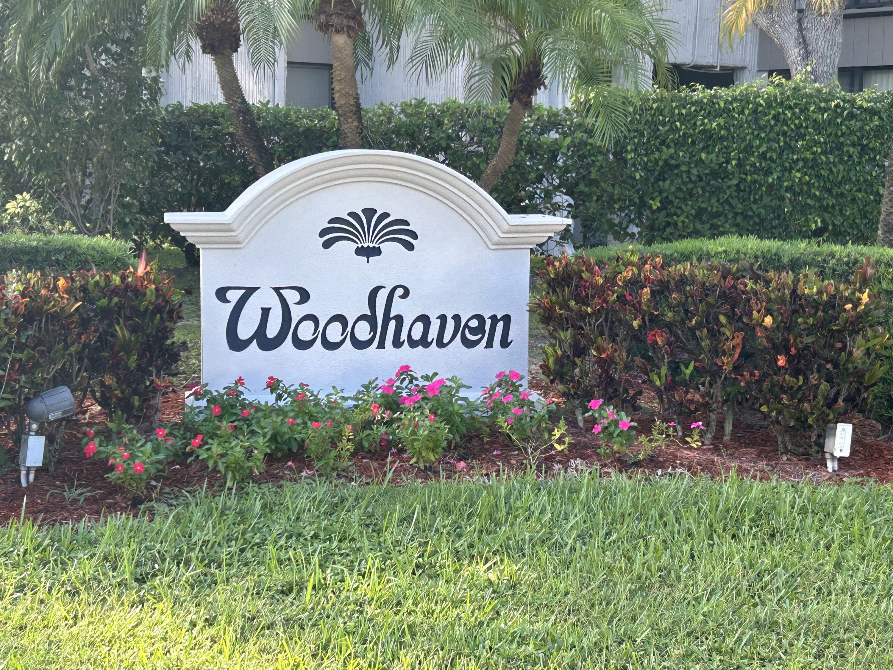 6514 Spring Bottom Way, Unit 125 Boca Raton, FL 33433 - Photo 28 of 28 a sign that is sitting in front of flowers