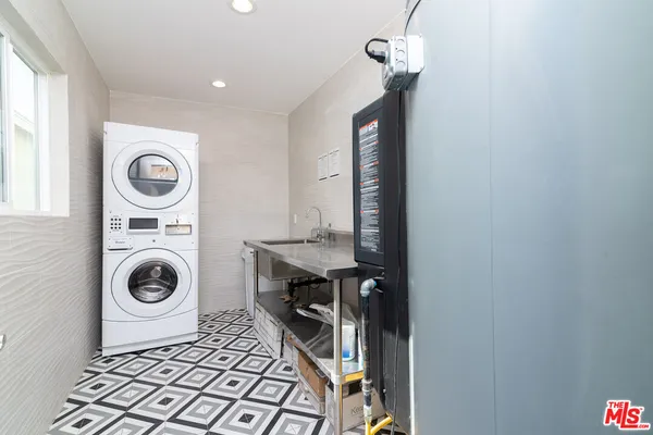 a view of a storage & utility room with a washer and dryer