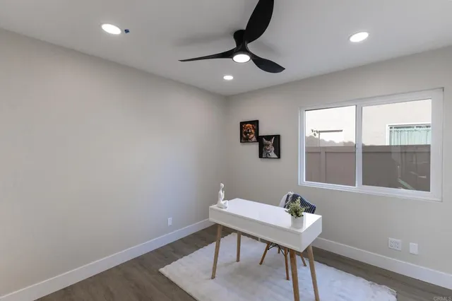 a workspace with furniture and window