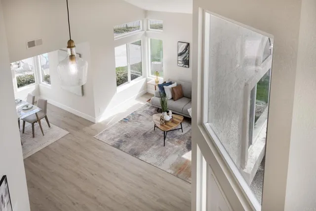 a living room with furniture and a table
