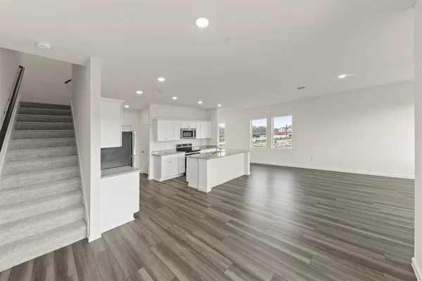 a spacious bathroom with a shower and a sink