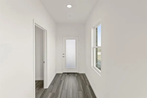 a kitchen with stainless steel appliances granite countertop a stove a sink and a granite counter tops with wooden floors