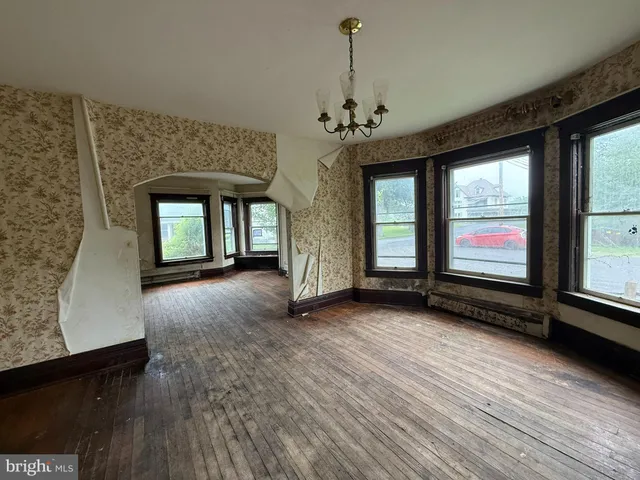 a view of a room with large windows