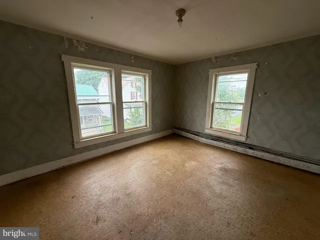 an empty room with windows