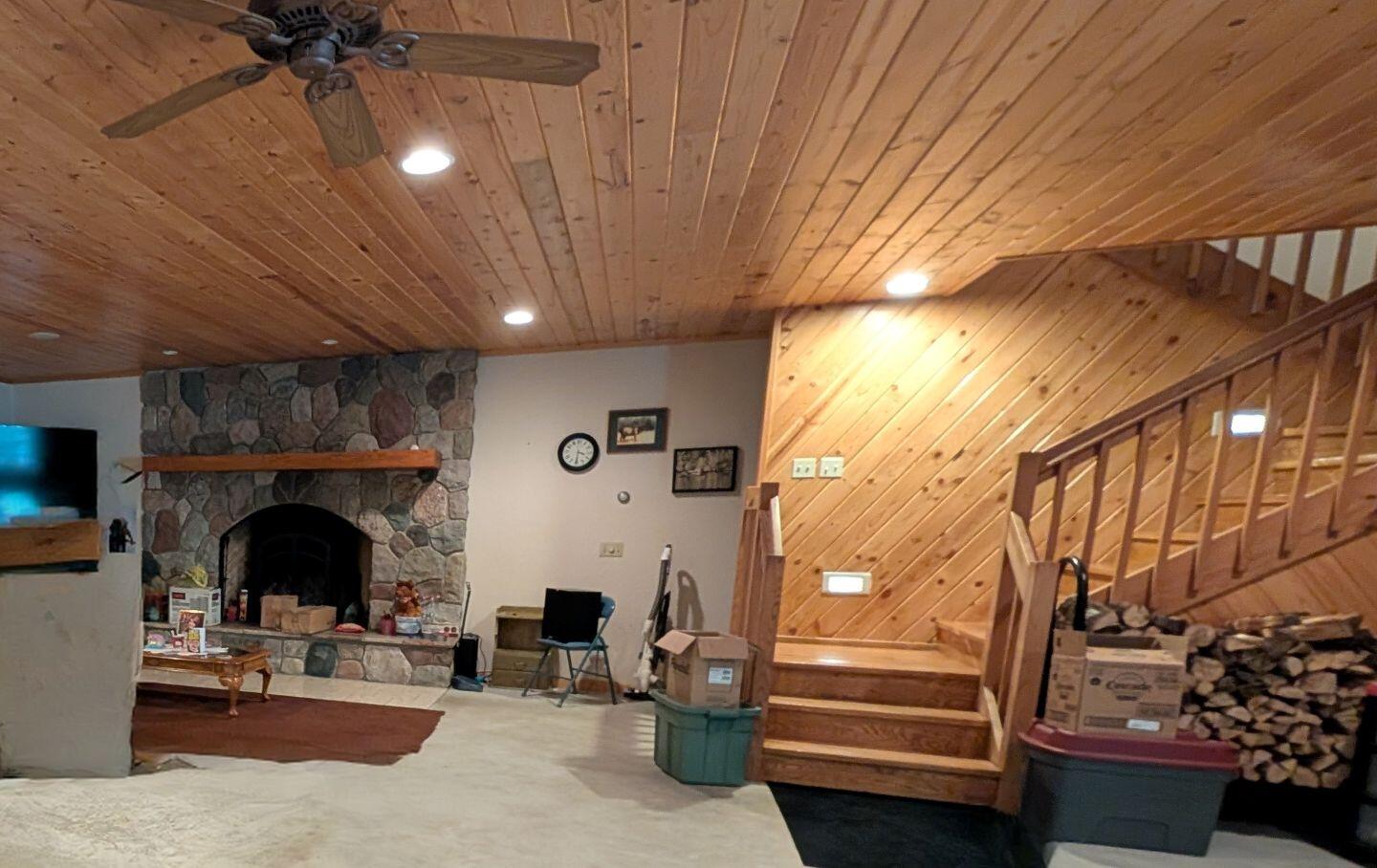 2878 East Spruce Road Spruce, MI 48762 - Photo 25 of 36 LOWER LEVEL WITH FIREPLACE AND STAIRS