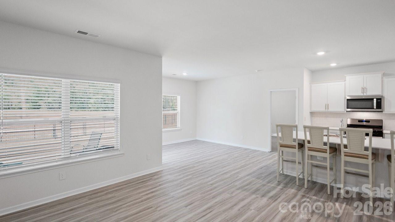 3688 Mercer Street Terrell, NC 28682 - Photo 16 of 34 a view of a dining room with furniture and wooden floor