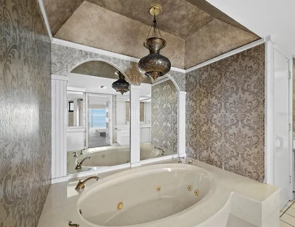 a bathroom with a granite countertop sink and a toilet