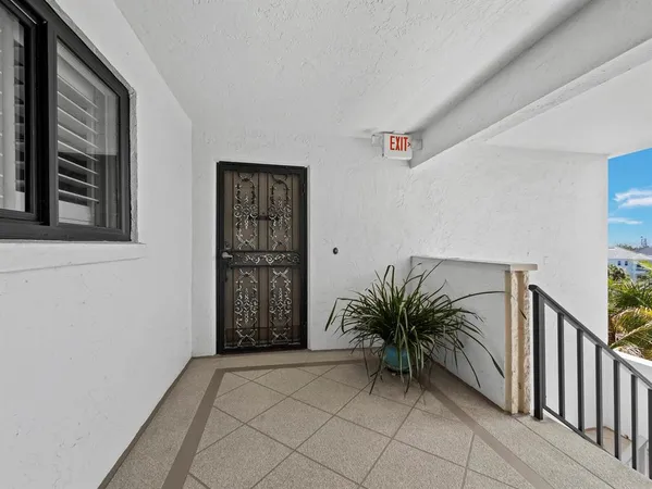 a view of a balcony with wooden floor and lake view