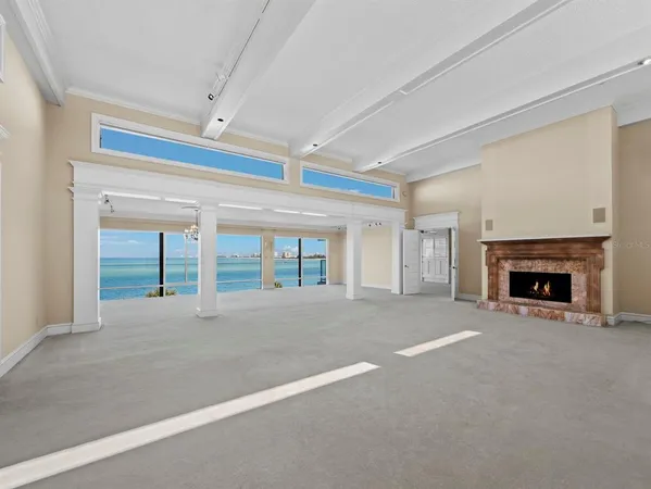 a view of an empty room with a fireplace
