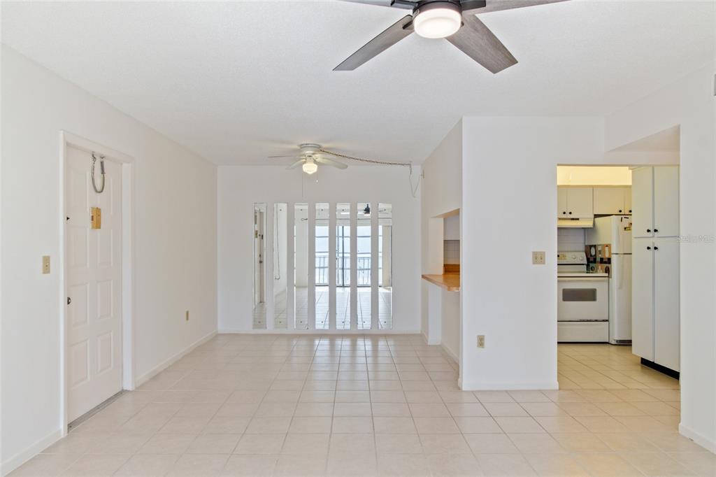 1308 Pine Ridge Circle East, Unit H2 Tarpon Springs, FL 34688 - Photo 3 of 17 wooden floor in an empty room