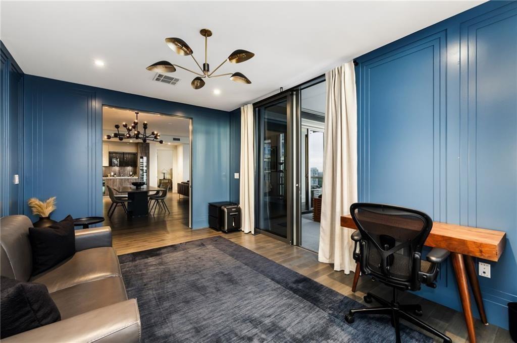 3107 Peachtree Road Northeast, Unit 1803 Atlanta, GA 30305 - Photo 16 of 45 a view of a livingroom with furniture and gym equipment