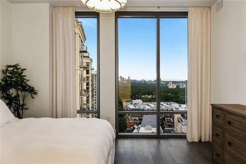 a bed room with a bed and a window