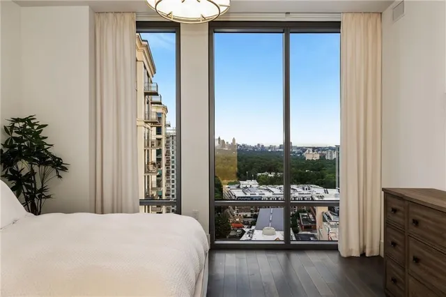 a bed room with a bed and a window