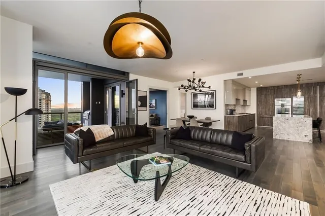 a living room with furniture and a mirror