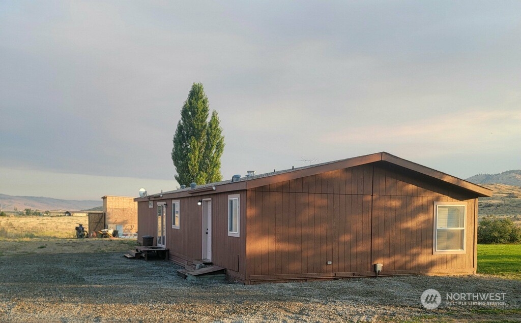 256 C Riverside Cutoff Road Riverside, WA 98849 - Photo 3 of 36 a view of a house with backyard