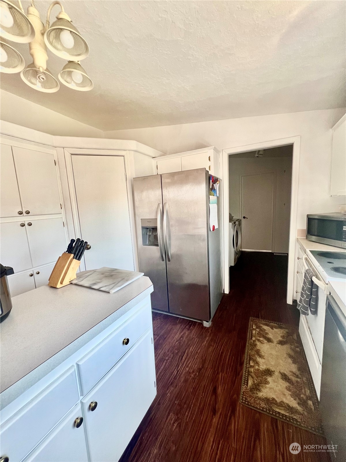 256 C Riverside Cutoff Road Riverside, WA 98849 - Photo 10 of 36 a kitchen with a refrigerator and a sink
