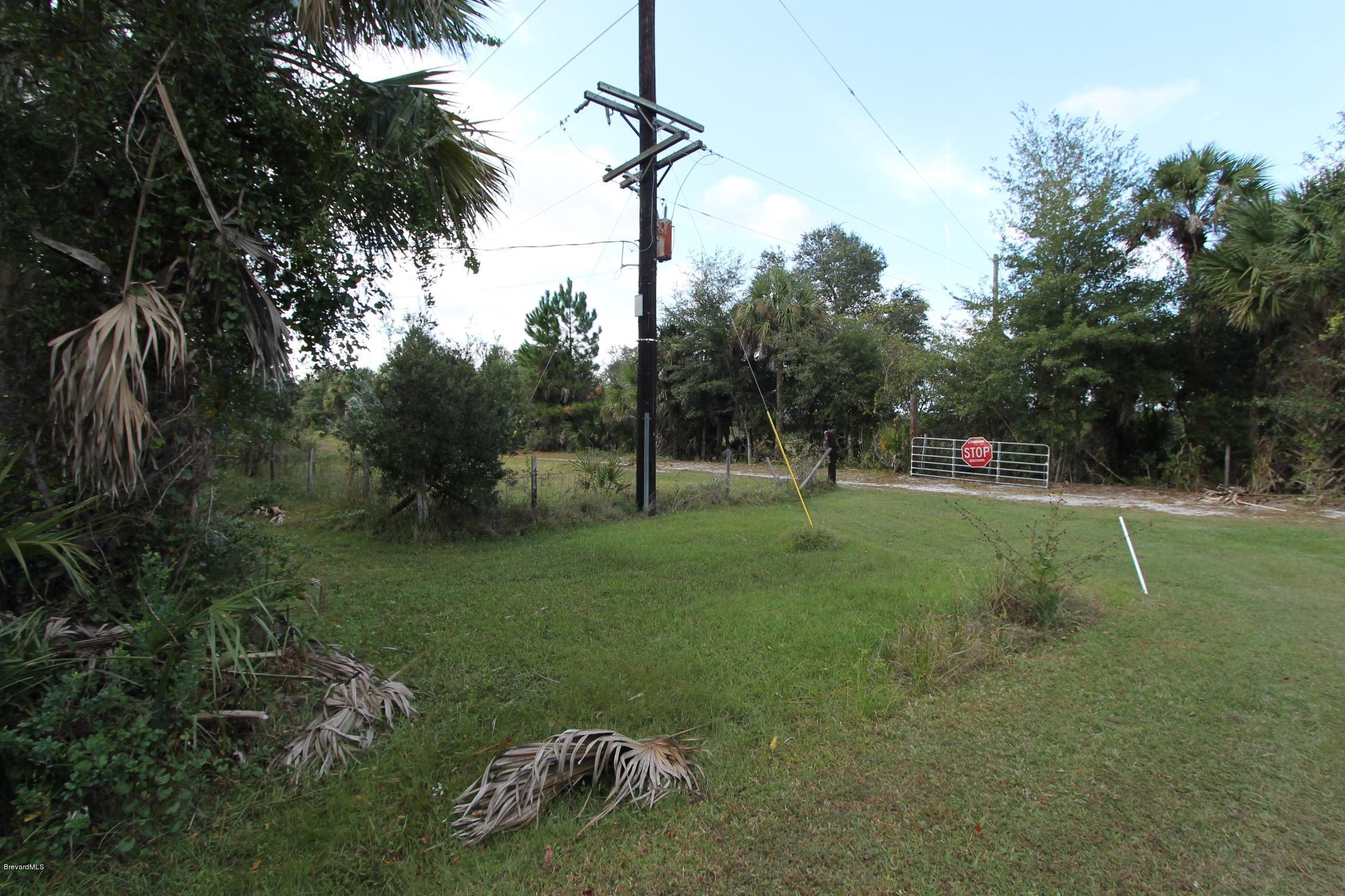 451 Liberty Road Mims, FL 32754 - Photo 4 of 22 entrance gate to property
