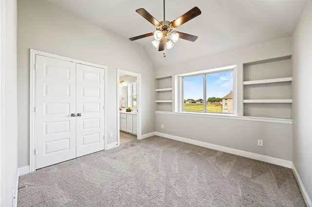 a bedroom with a bed dresser and a window