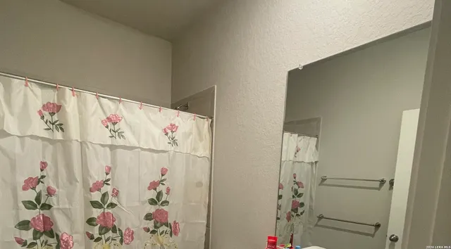 a white wall with lots of different colored cloths