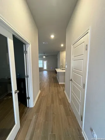 a view of a kitchen from the hallway