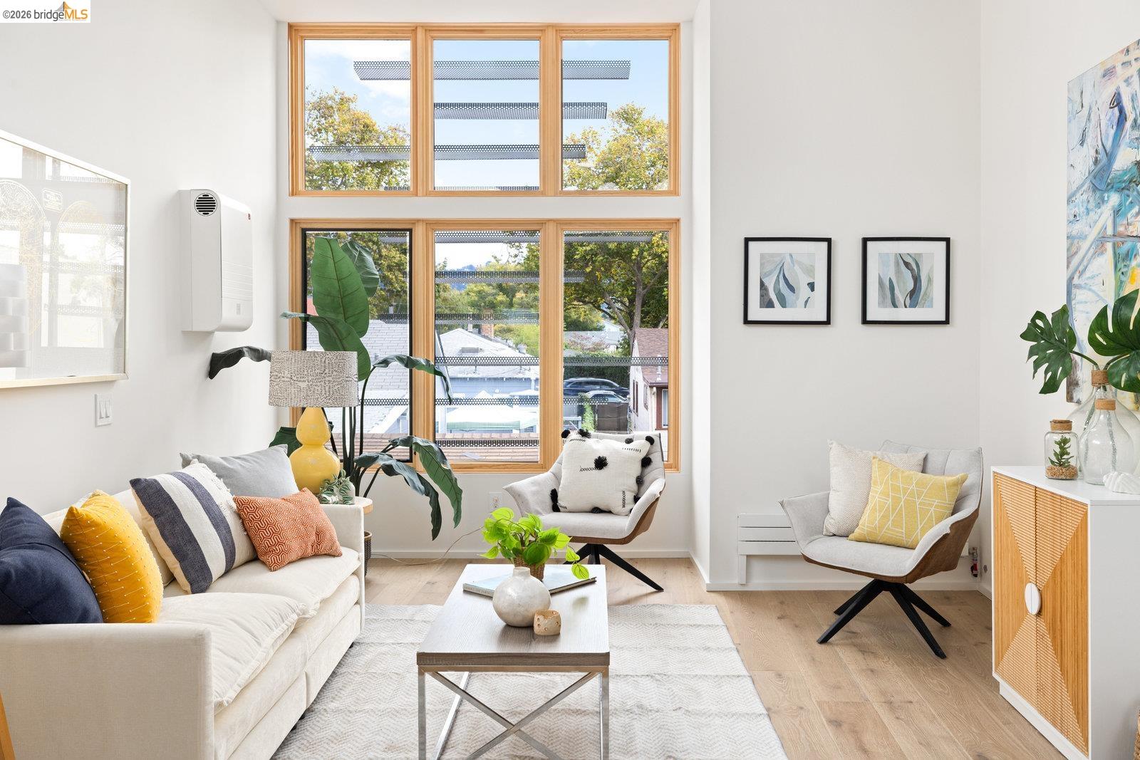 809 Jones Street Berkeley, CA 94710 - Photo 23 of 33 a living room with furniture and floor to ceiling windows