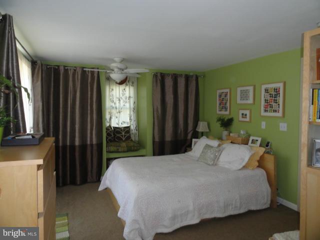 403 Paradise Road Riva, MD 21140 - Photo 15 of 22 a bedroom with a bed window and dresser