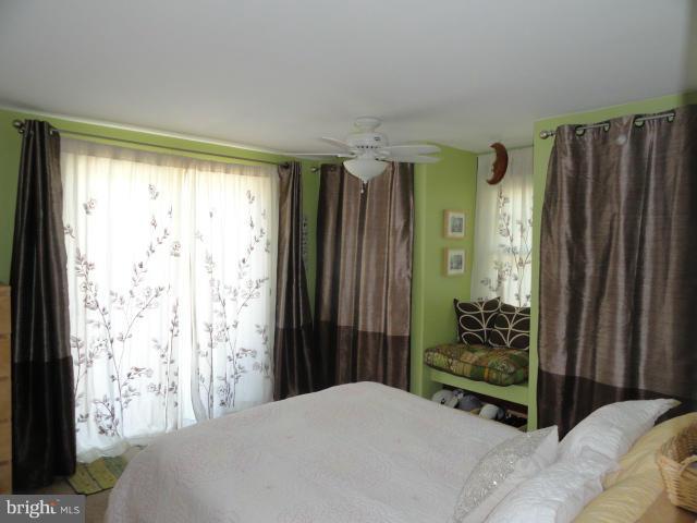 403 Paradise Road Riva, MD 21140 - Photo 16 of 22 a bedroom with a bed and a window