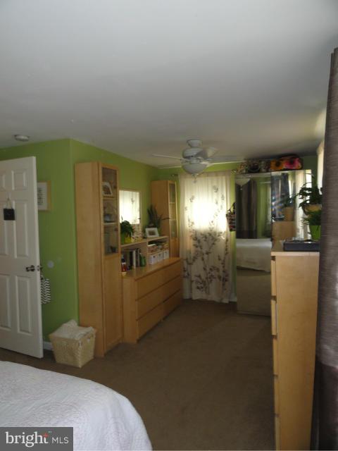 403 Paradise Road Riva, MD 21140 - Photo 17 of 22 a room with lot of cabinets and wooden floor